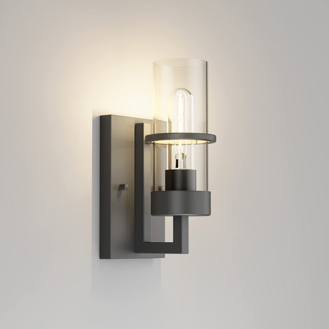 Tipace black wall light with clear glass shade for modern living room ambiance.