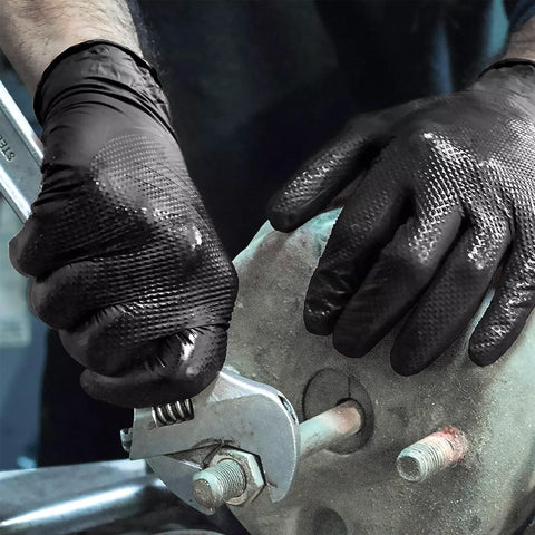 TitanFlex mechanic gloves showing precision grip for small parts and tools.