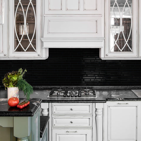 Tiwoos tile behind stove demonstrating safe distance and practical installation.