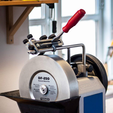 Tormek SE-77 supports Japanese chisels for tapered blade sharpening.