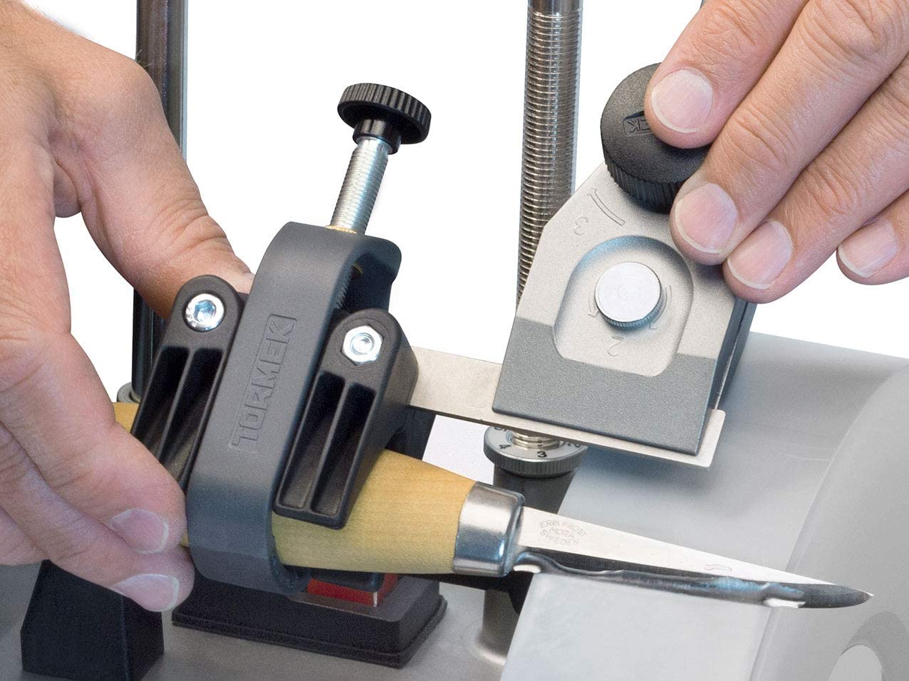 In action with SVM-45, the holder guides tiny blades for consistent edge angles.