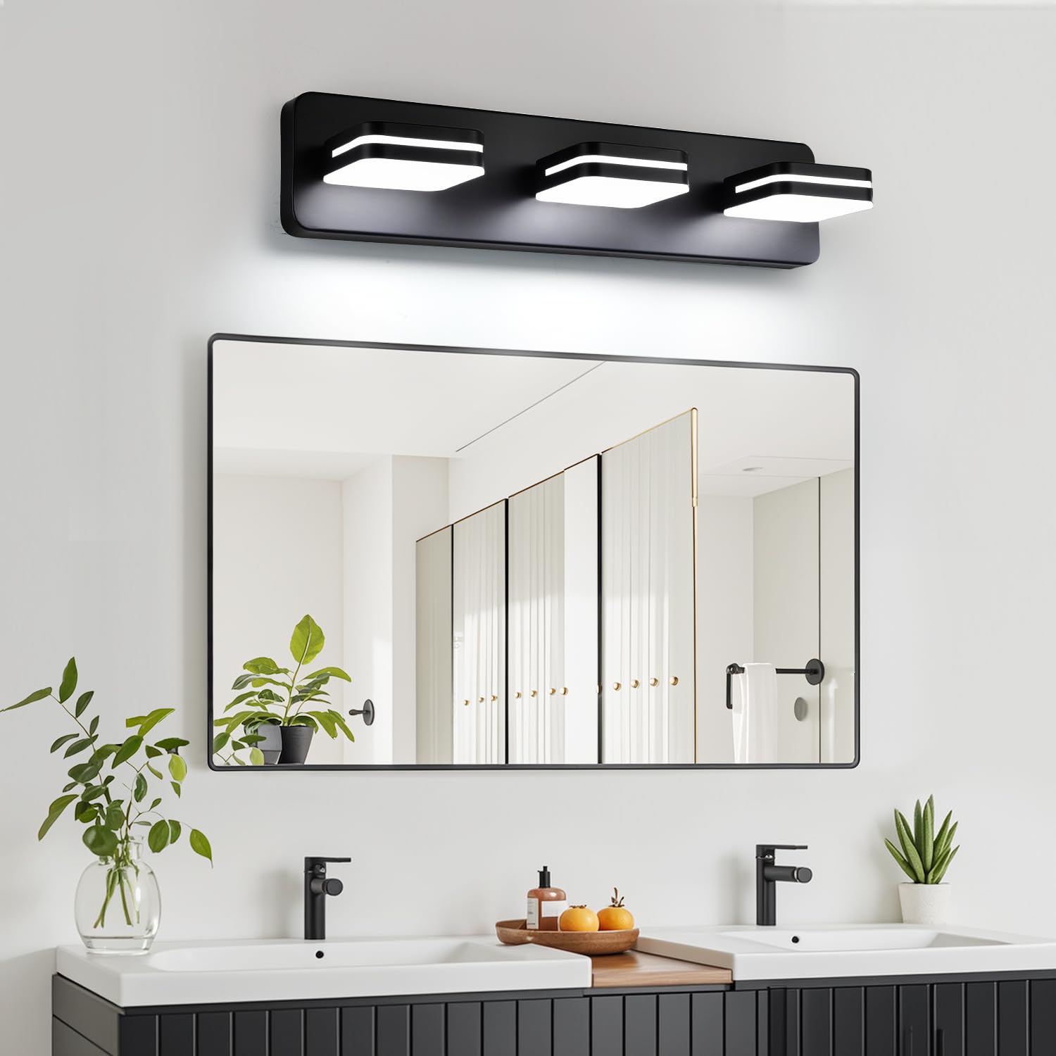 Torondo three-light vanity fixture offering versatile ceiling-to-wall illumination.