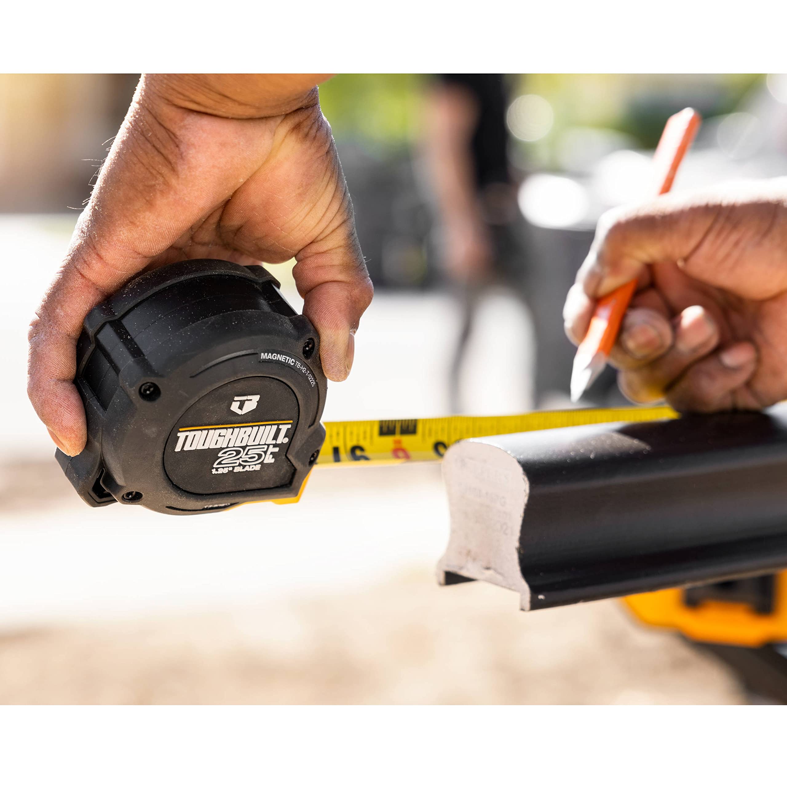 ToughBuilt ProBlade tape measure ergonomic grip reducing hand fatigue.