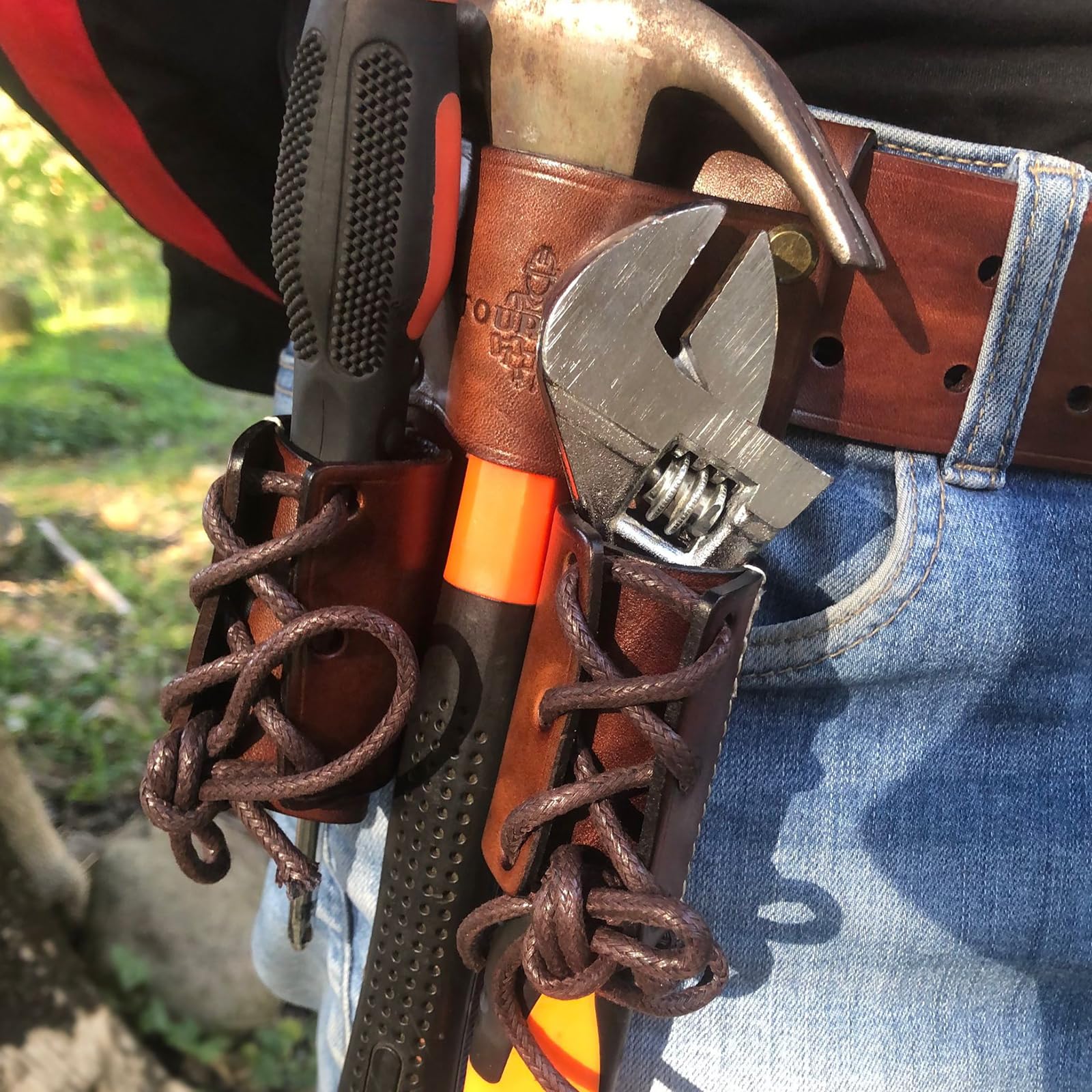 Tourbon harness leather construction with tunnel loop and rivet reinforcement.