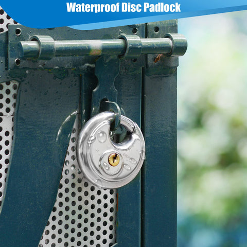 Travate padlock securing a gate fence in a backyard setting.
