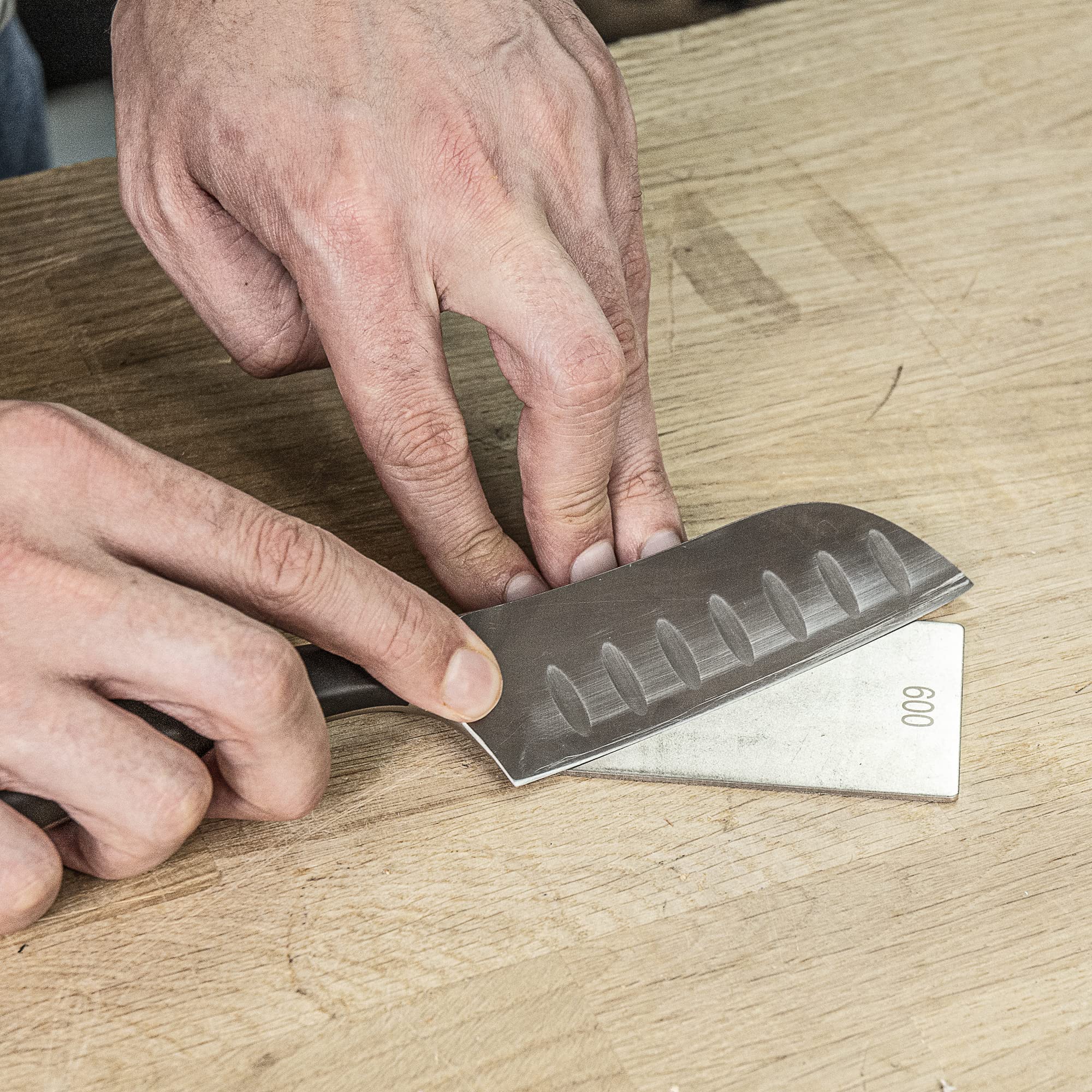 TREND compact diamond sharpening stone on workbench for quick touch-ups.