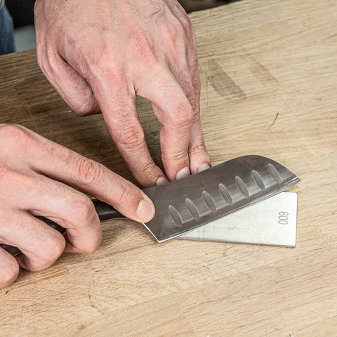 TREND compact diamond sharpening stone on workbench for quick touch-ups.