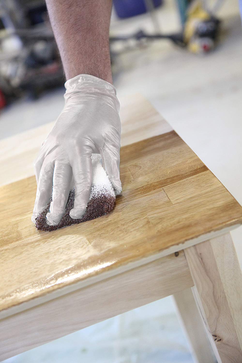 Free gloves included with Trimaco staining pad for cleaner handling during staining.