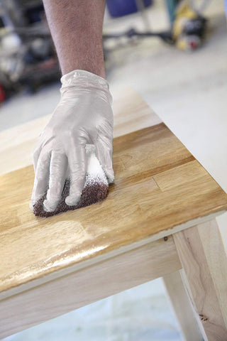 Free gloves included with Trimaco staining pad for cleaner handling during staining.