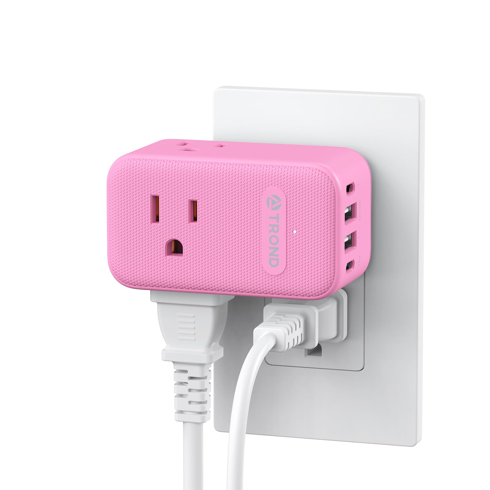 TROND pink outlet extender with 360-degree rotation behind a couch for flexible placement.