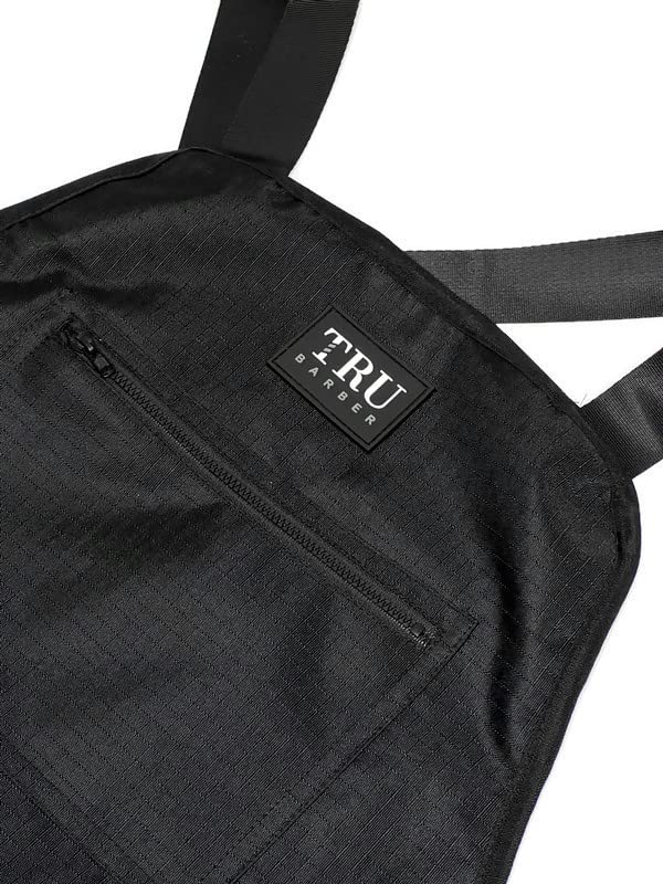 Water-repellent TRU BARBER apron helps stay dry during client shampooing.