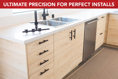 Hand calibrated cabinet jig by True Position Tools ready for repeatable installs.