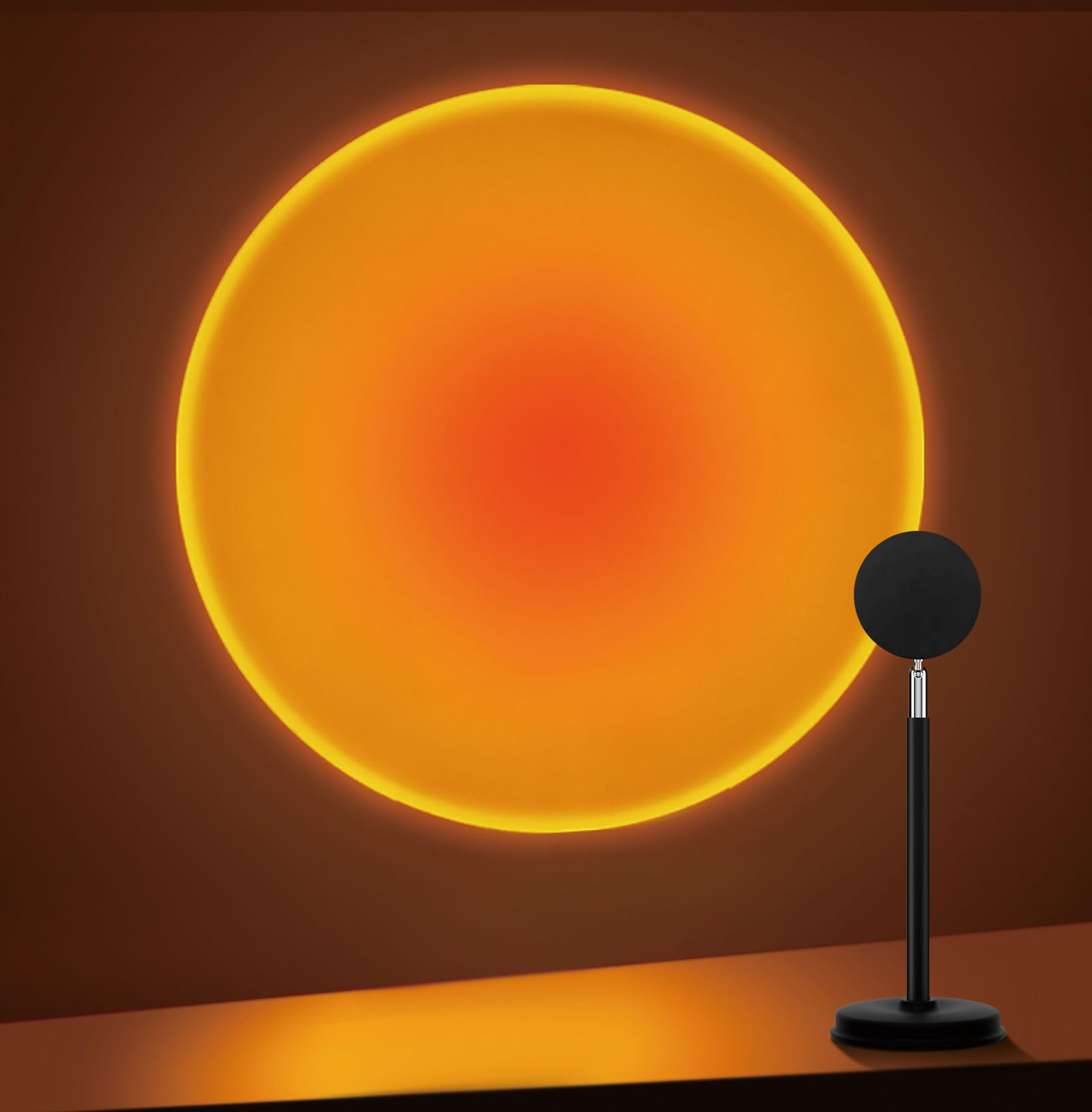 Tsrarey Sunset Lamp Projector casts warm sunset glow on wall.