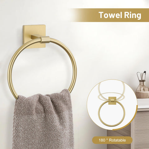 TURS brushed gold toilet paper holder with shelf for essentials.