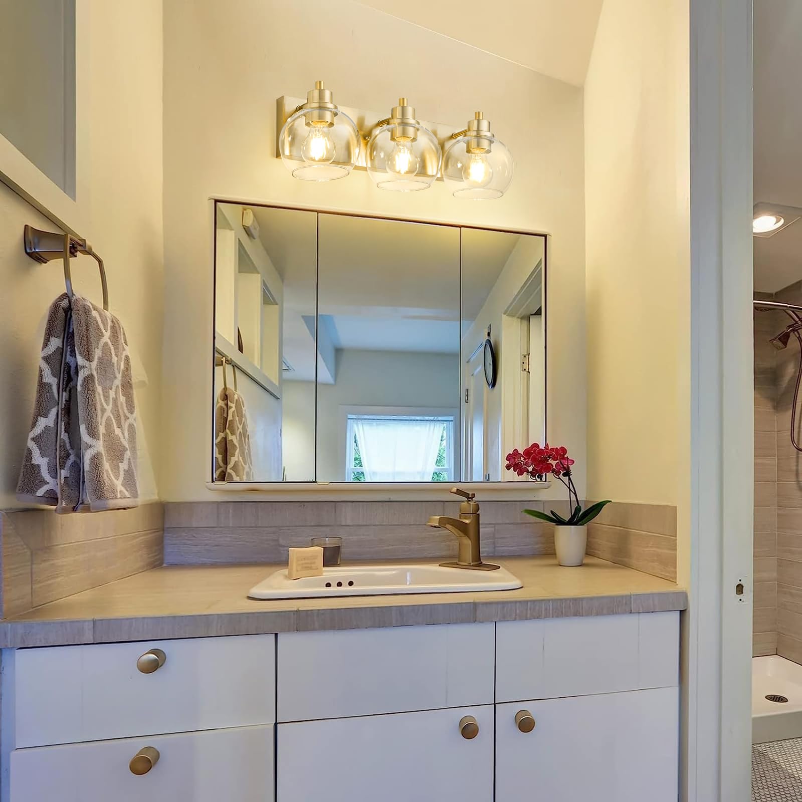 Tuscarora brushed gold hardware detail for luxe bath.
