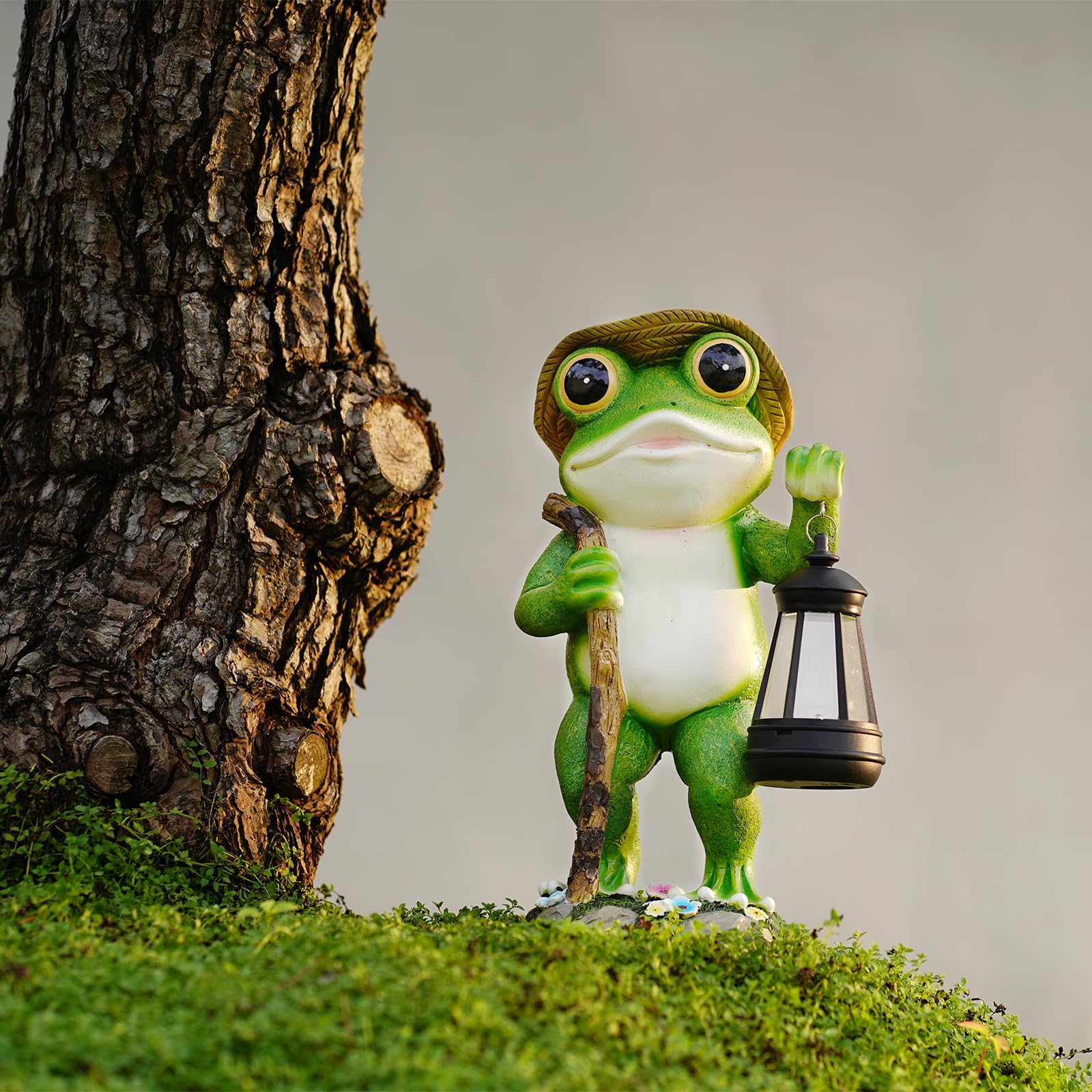 Twinbling solar-powered frog figurine glowing softly after charging