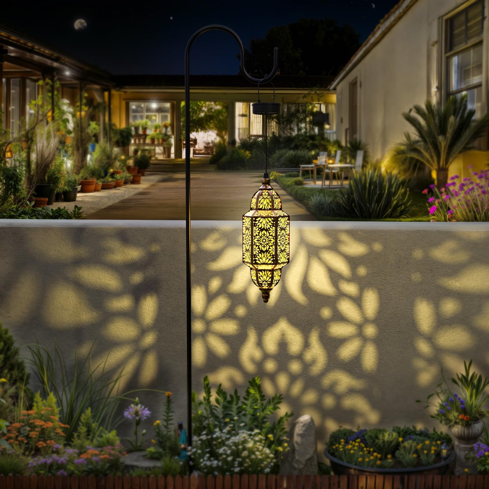 Twinkya Moroccan pattern projection lights cast intricate shadows on walls and paths.
