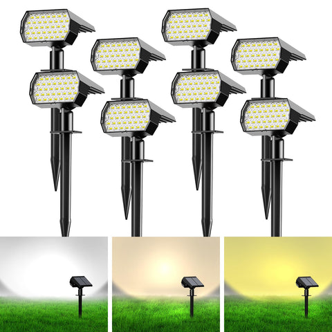 Ugecl solar spot lights illuminate a manicured lawn with easy stake installation.