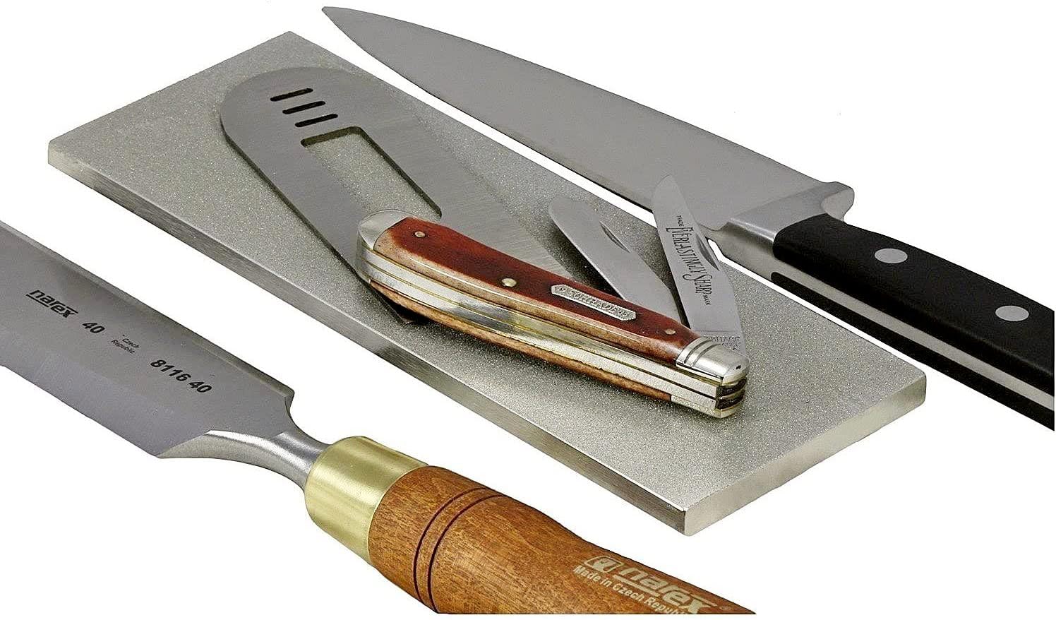 Ultrasharp 8x3 stone set in action with various knives for sharpening.