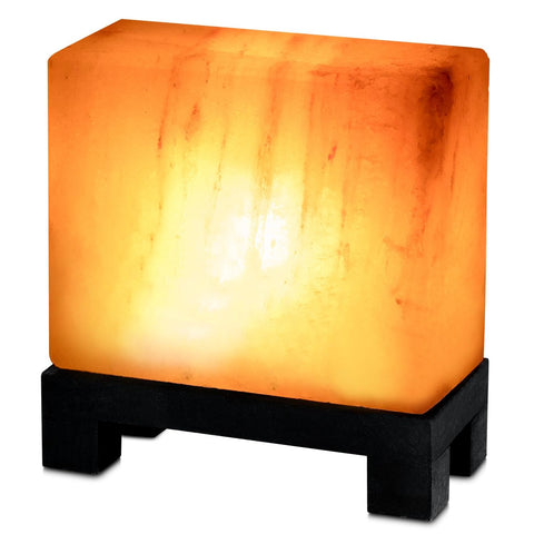 UMAID Himalayan salt lamp rectangle on wooden base provides warm ambient lighting.