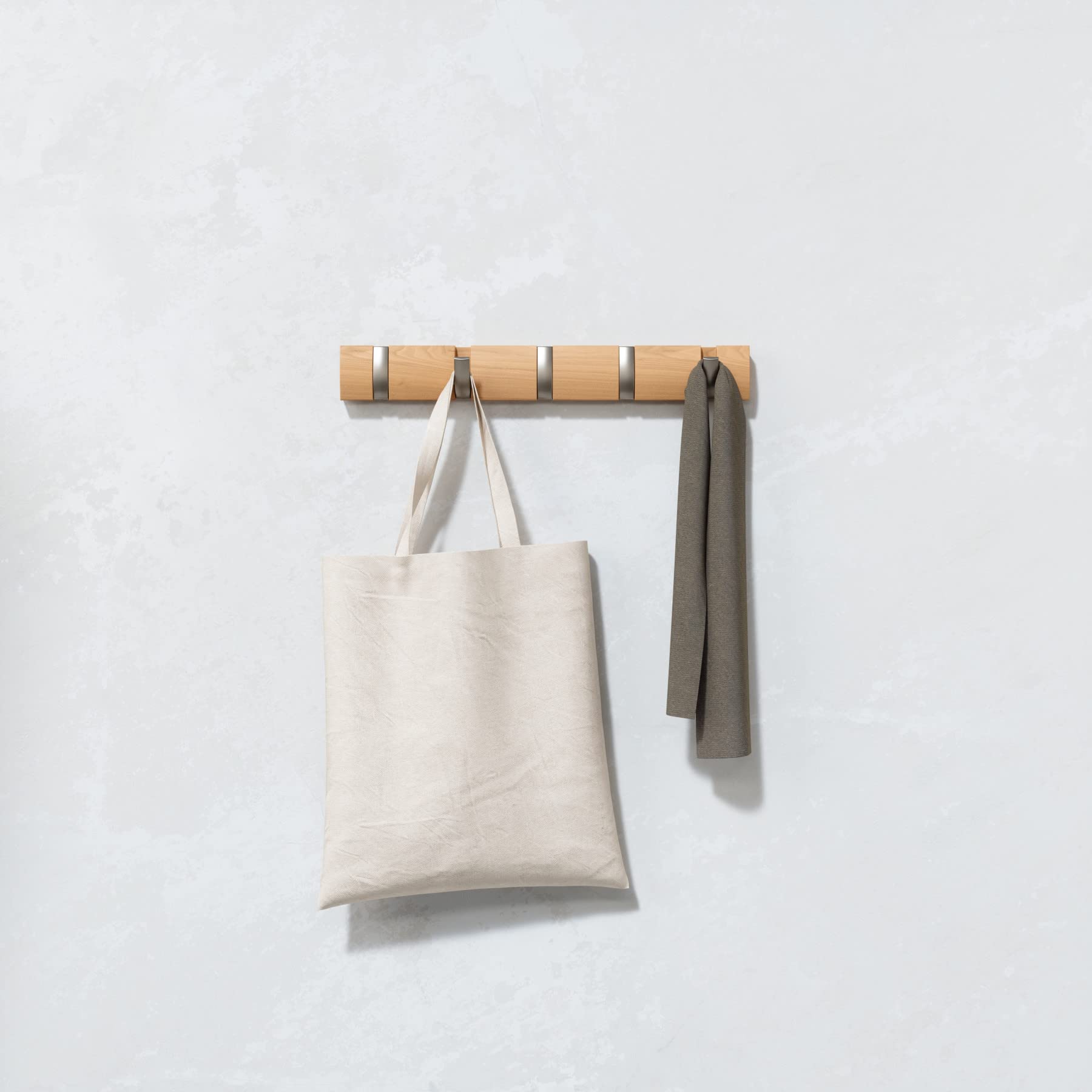 Umbra Flip 5 retractable hooks save floor space in small foyers.