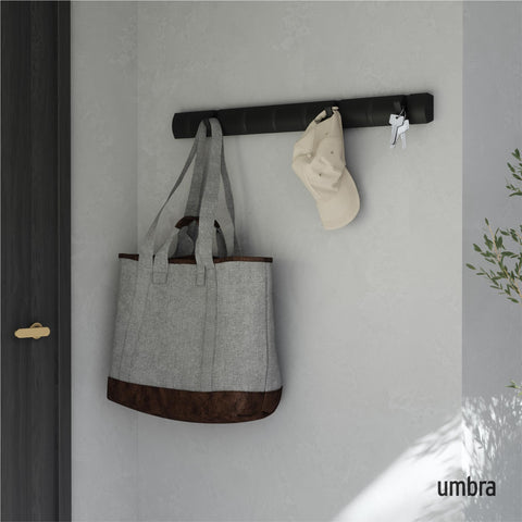 Umbra Flip retractable hooks close-up showing space-saving versatility.