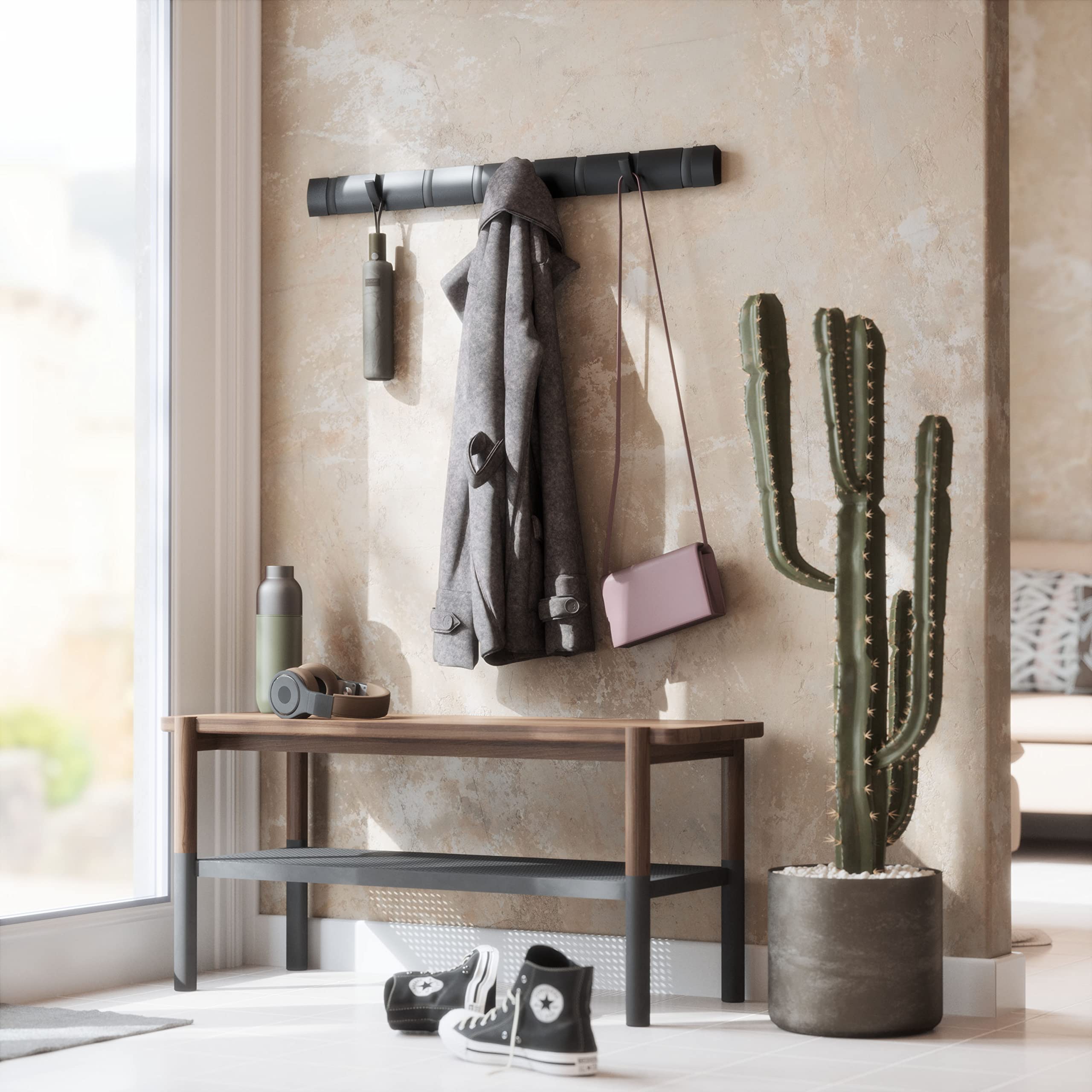 Umbra Flip space-saving profile ideal for tight hallways or mudrooms.