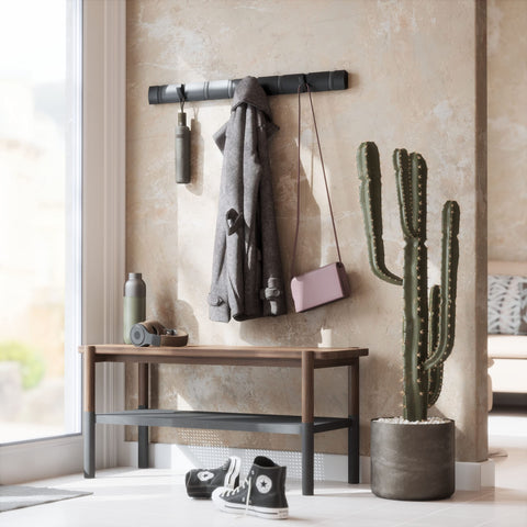Umbra Flip space-saving profile ideal for tight hallways or mudrooms.