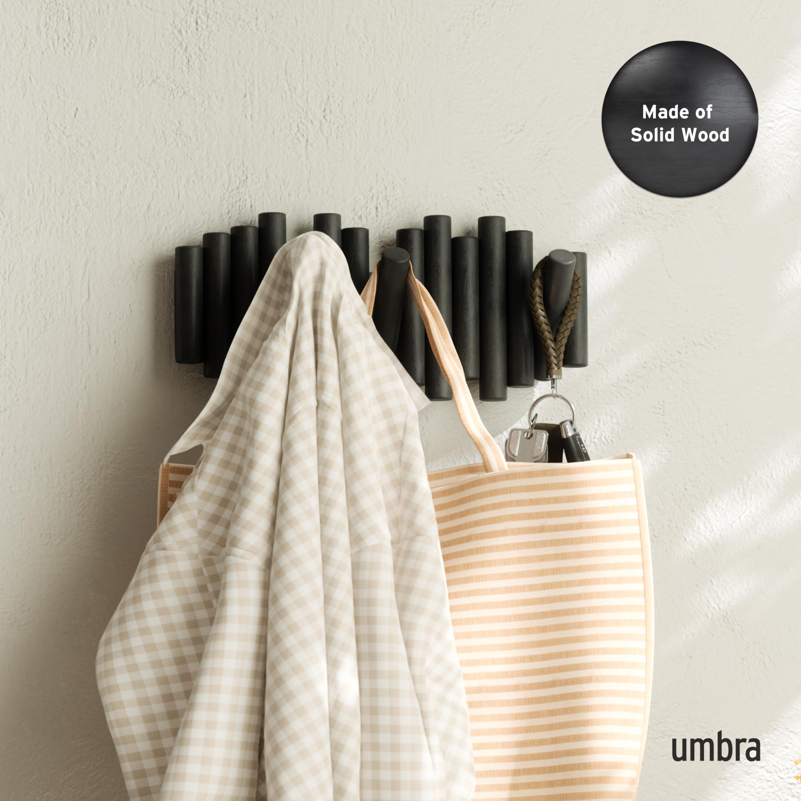Umbra Picket flip-down hooks close-up showcases smooth pine wood and seamless profile.