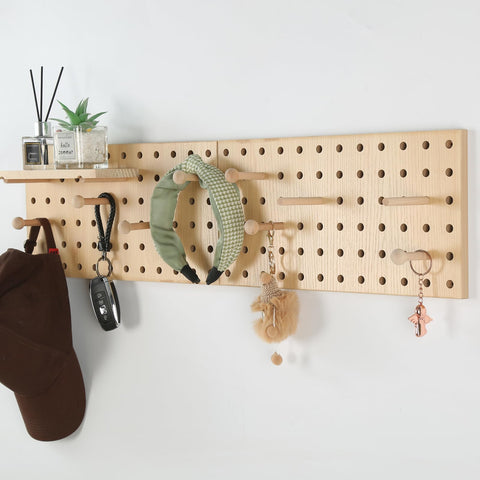 UMICAL beige wood pegboard kitchen storage keeps utensils within easy reach.