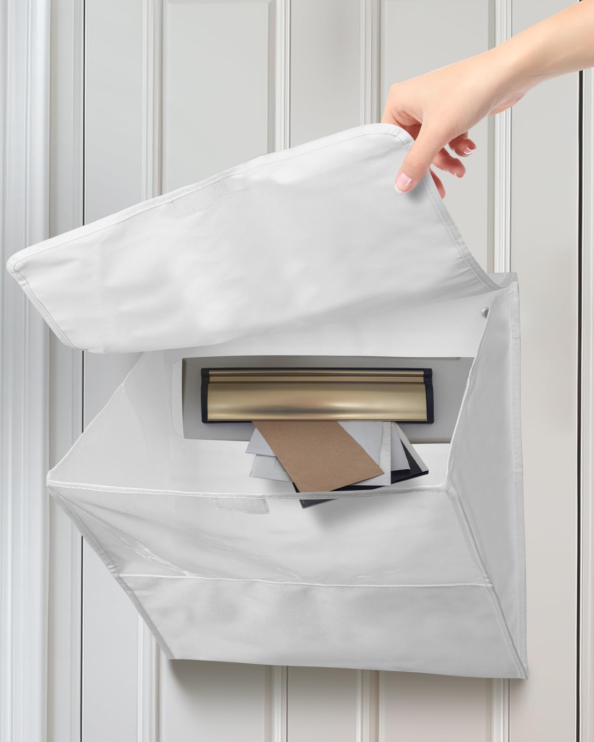 Uniclife White Mail Slot Catcher mounted on the front door keeps mail tidy and protected.