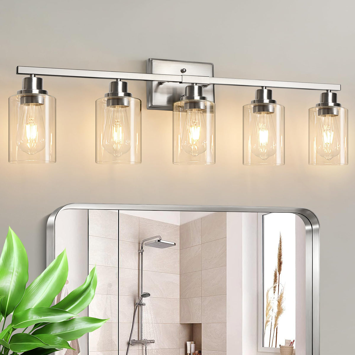 Unicozin 5-light vanity fixture with brushed-nickel finish and clear glass shades for modern bathrooms.