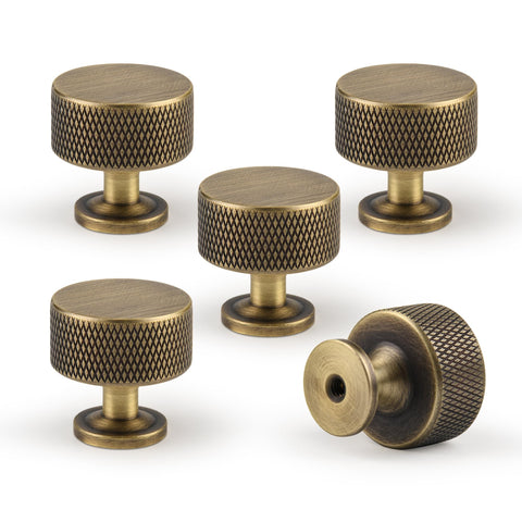 Urnew antique brass knob with 1.1-inch diameter for kitchen cabinets and durable hardware.