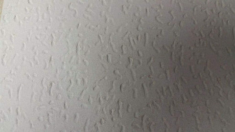 USG Interiors Tivoli wood fiber panel tile highlighting natural texture and warmth.