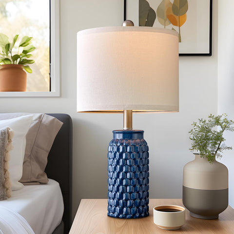 USumkky linen-shade lamp emits a softened glow ideal for bedrooms.