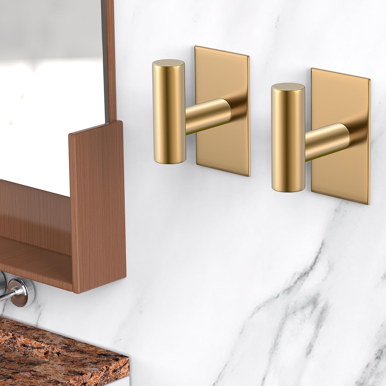 Gold four-pack of VAEHOLD hooks ready for kitchen organization.