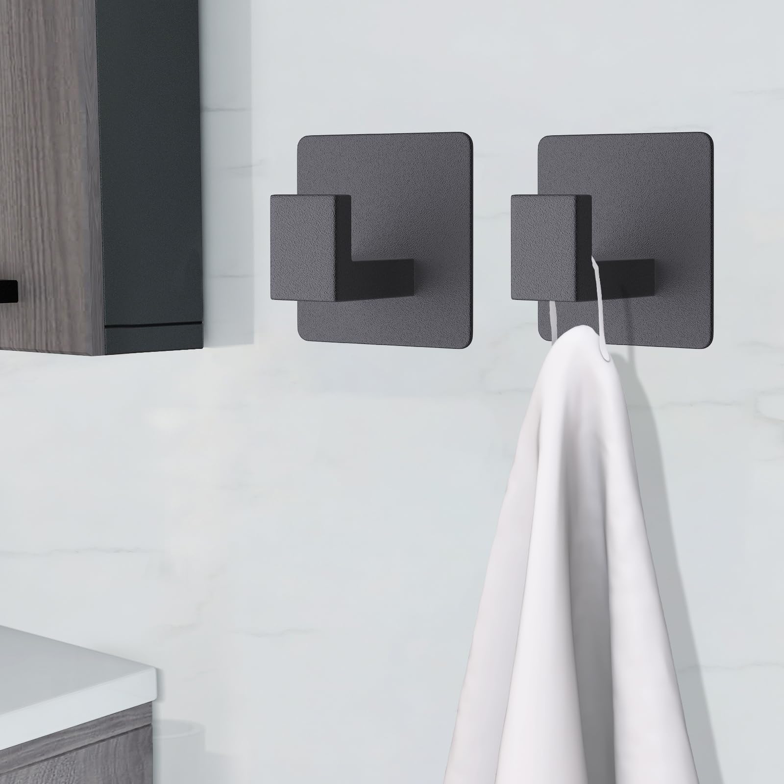 VAEHOLD hook on smooth surface proves adhesion on tiles, glass, metal.