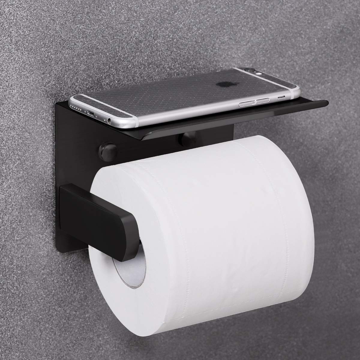 Close-up of VAEHOLD stainless steel wall-mount toilet paper holder.