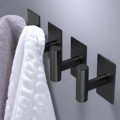 VAEHOLD wall hook on ceramic tile demonstrating easy, damage-free mounting.