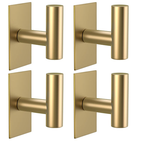 VAEHOLD gold wall towel hook showing strong adhesion on a smooth surface.
