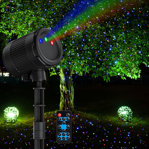 VanSmaGo laser christmas projector outdoors casting RGB fireflies on the home façade.