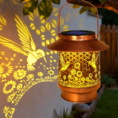 Vcdsoy hummingbird solar lantern on patio glows warmly for evenings.