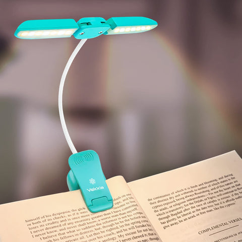 Vekkia 14 LED book light clipped on a book for focused nighttime reading