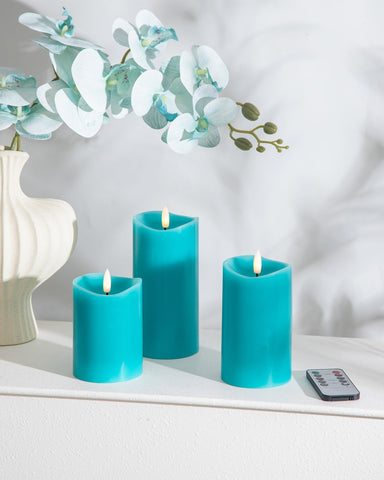 Velsyn teal flameless candle 4-inch with 3D flame adds soft shelf lighting