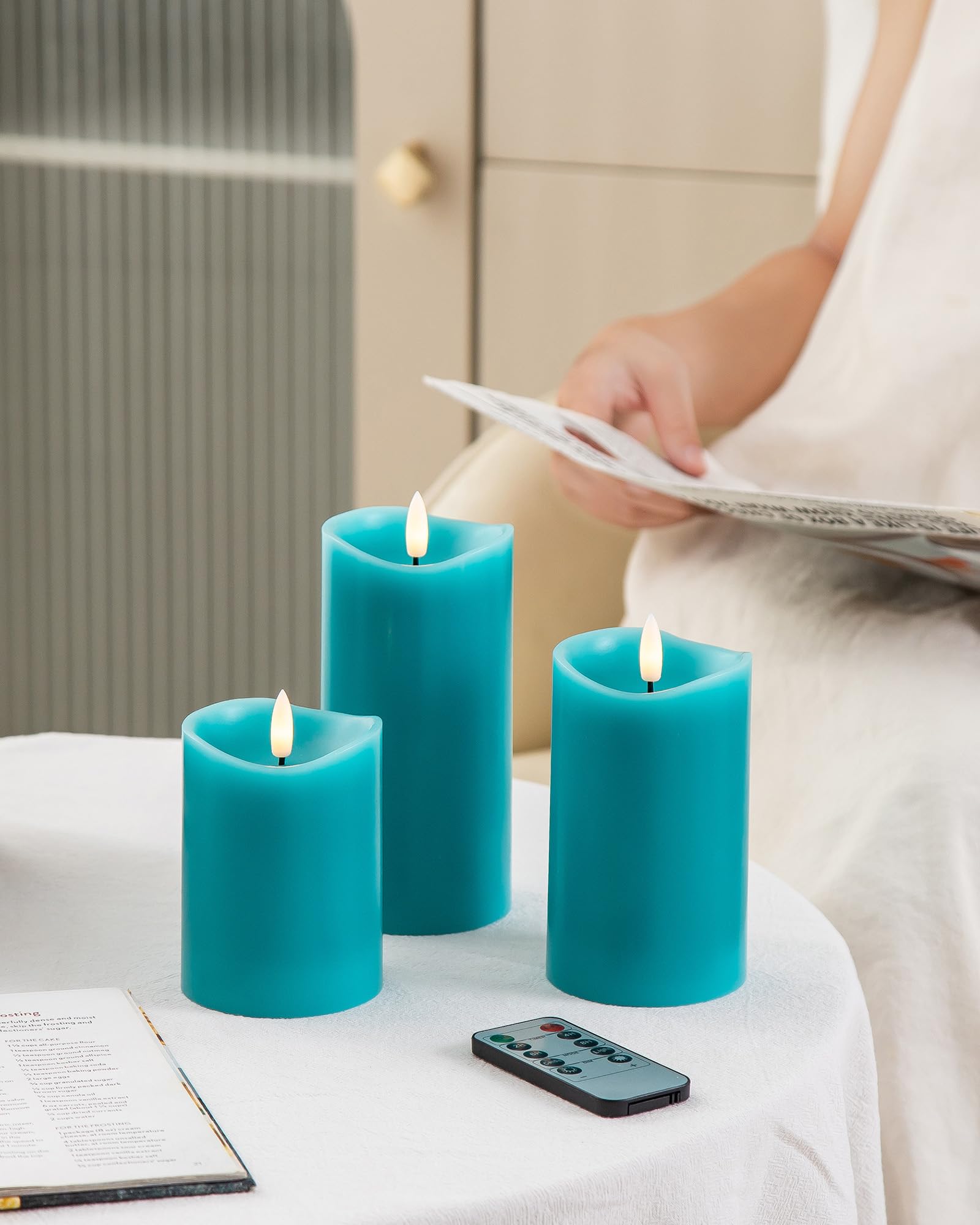 Velsyn teal pillar candles offer safe lighting with realistic flame effects