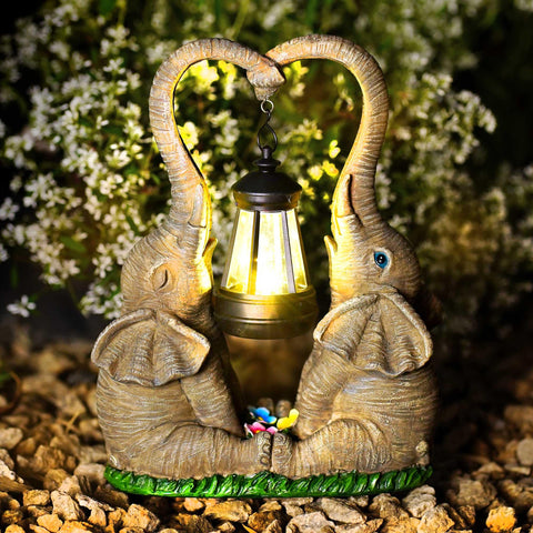 Vereemy solar-powered statue charges in sun and lights up evenings.