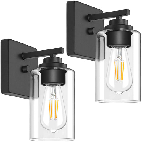 VerRon set of two wall sconces with matte black finish and clear glass shade.