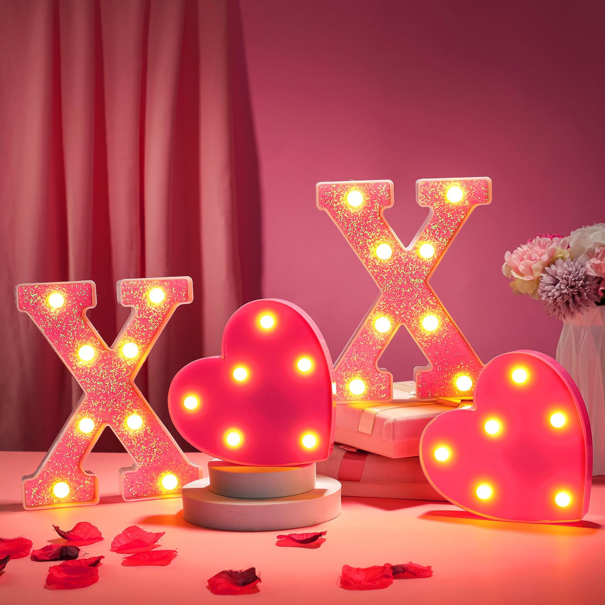 VIHOSE XOXO pink glitter letters illuminate a romantic table setting