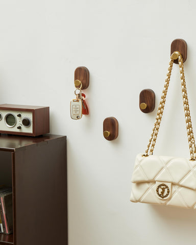 Hooks holding coats and bags to illustrate versatile hanging solutions.