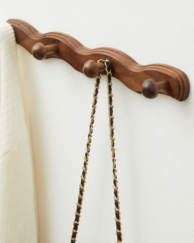 Walnut-finish Vinoil coat rack enhances decor with practical storage